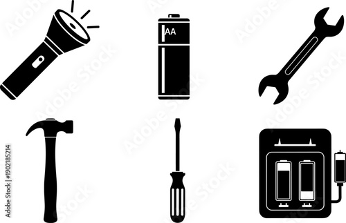 Collection of essential tools and power sources including a flashlight, batteries, and wrench