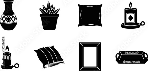 Collection of decorative home interior objects including vase, plant, pillows, candles, frame, and tray