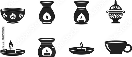 Collection of decorative aromatherapy and incense burners with candles and a cup