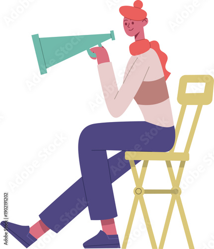 Person sitting on director chair holding megaphone