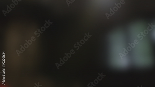 Tableau sur toile Dark blurry background with soft bokeh lights and moody atmosphere for cinematic