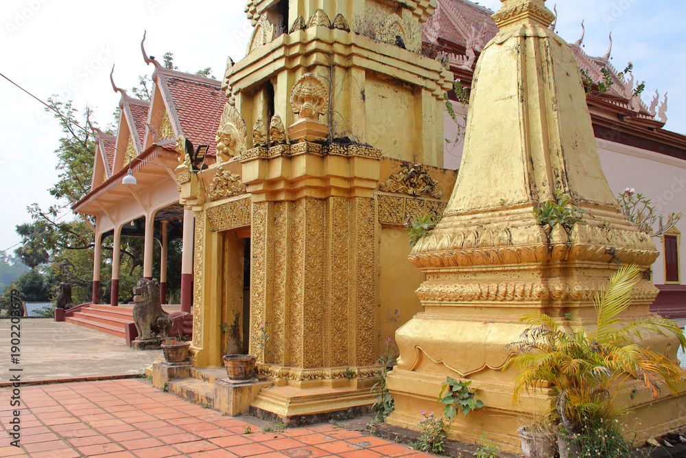 Fototapeta premium buddhist monastery closed to a ruined ancient hindu and buddhist khmer temple (lolei) in angkor in siem reap in cambodia 