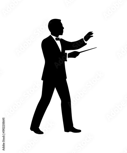 Silhouette of a male conductor in formal wear directing a classical music orchestra