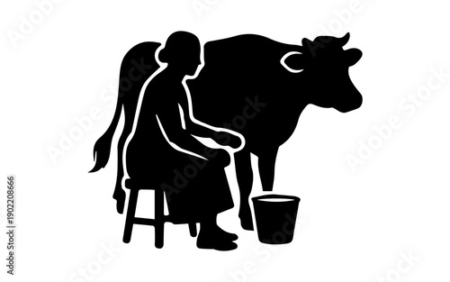 Woman milking cow symbol of traditional dairy farming