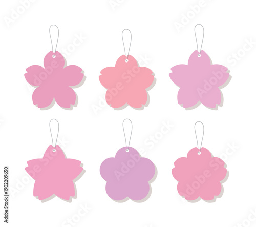 Set of 6 pink cherry blossom gift tags with strings. Various sakura flower shaped paper labels in soft pastel colors, perfect for spring wedding favors, birthday gifts, and seasonal packaging.