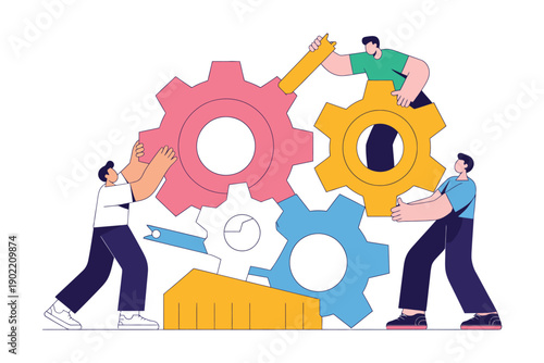 Three people working together to assemble large colorful gears