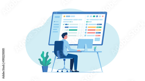 A man sitting at a desk in front of a large computer monitor working on data analysis with a potted plant nearby