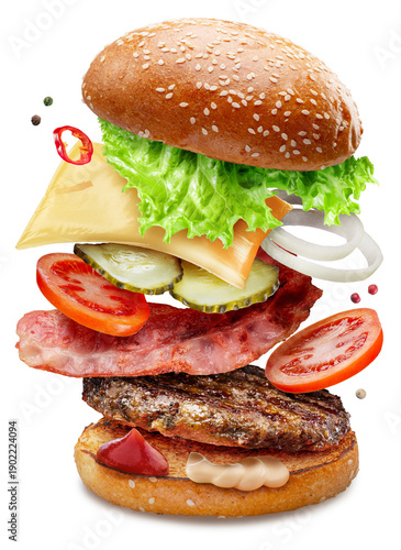 Hamburger or cheeseburger ingredients fall one by one on a white plate on a white background. With clipping paths.