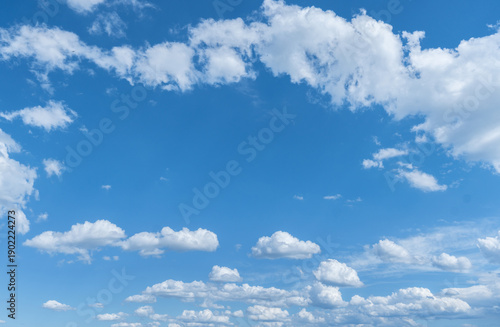 Deep blue sky with beautiful cumulus clouds.