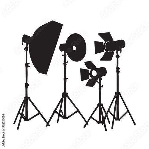 Professional photography and film studio lighting equipment silhouette set on tripods