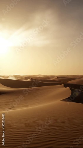 Dawn Glow over Hazy Dunes Soft, diffused light illuminating a distant desert horizon through a gentle atmospheric haze.