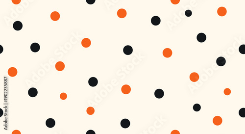Seamless Pattern of Orange and Black Polka Dots on a Cream Background