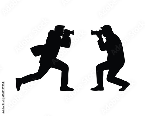 Two photographers in action, capturing moments with their cameras in a dynamic and creative pose.