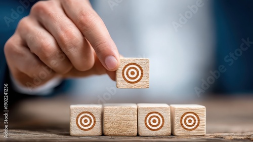Wallpaper Mural Hand Placing Wooden Block with Target Symbol on Stack Torontodigital.ca