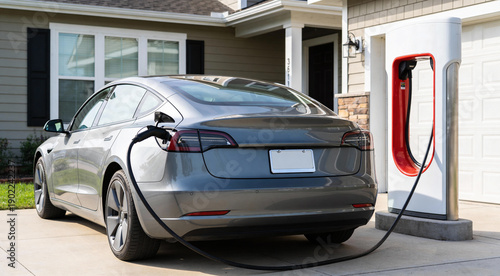 Electric battery car charge at EV station. concept of EV car and home charging station. Electric car charging. Electric car with a connected charging cable. Charging point