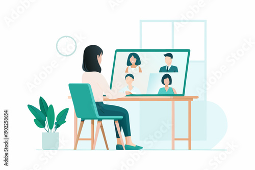 Woman participates in a video conference call with colleagues on a laptop