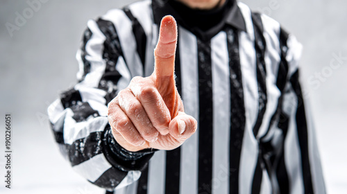 Wallpaper Mural Hockey referee in sports uniform showing finger gesture. Clear communication concept representing rules, decision, authority, referee control, stop or attention signal for sports media and education. Torontodigital.ca