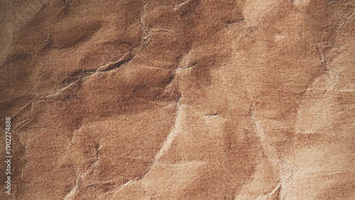 Closeup of brown wrinkled paper. Crumpled and wrinkled brown paper texture background