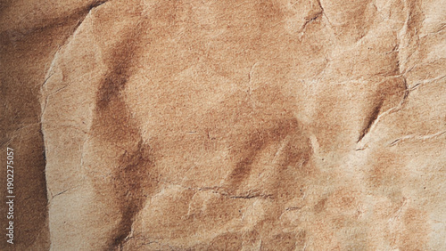 Closeup of brown wrinkled paper. Blank brown crumpled paper texture background, old page for craft design.