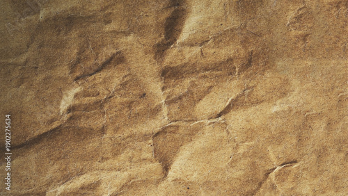 Closeup of brown wrinkled paper. Blank brown crumpled paper texture background, old page for craft design.