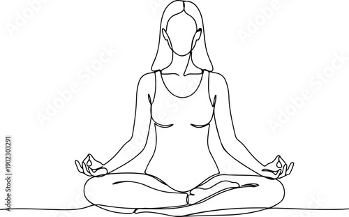 A woman is sitting in a lotus position with her eyes closed and hands on knees.