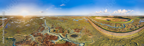 Aerial view of waterways in salt marshlands of Verdronken Land van Saeftinghe, together with polder Hertogin Hedwigepolder in 2016, currently depoldered, in 360 degrees panorama, Zeeland, Netherlands.
