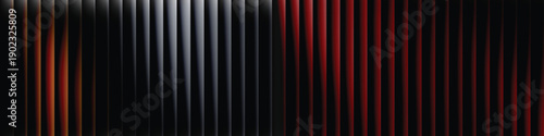 A dramatic view of a dark room with red and black vertical stripes on the wall
