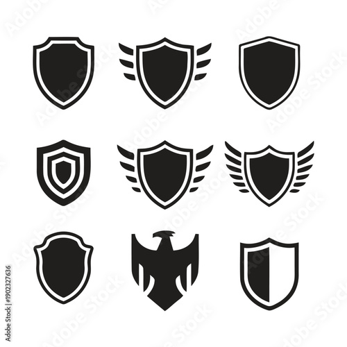 Collection of nine black shield icons with wings and geometric patterns