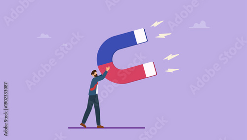 Businessman holding high power magnet to attract all benefits. Business attraction or charisma with power to draw or attract business opportunity, money or customers.
