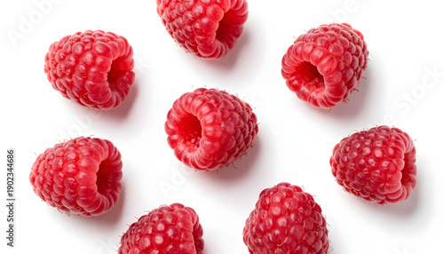 Fresh Ripe Raspberries Scattered on a Clean White Background for a Healthy Food Concept