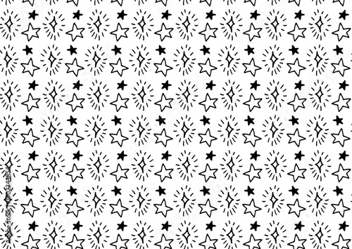 白黒の手描き星イラストパターン背景素材