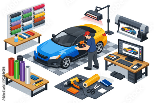 Car wrapping service with tools, vinyl rolls, printer, and computer design station