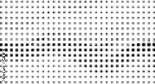 Black dots forming a gradient pattern on a white background