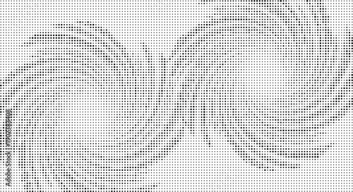 Black dots of varying sizes on a white background creating a textured pattern