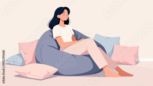 A woman is sitting on a bean bag chair with her legs crossed. She is wearing a white shirt and is looking at the camera. The scene is peaceful and relaxing, with the woman taking a break from her day