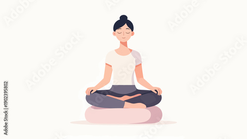 A woman is sitting cross legged on a pillow. She is smiling and looking to the right