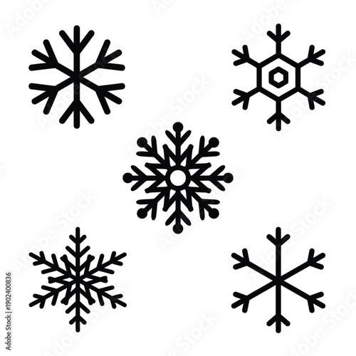 Five black snowflakes displayed against a plain white background