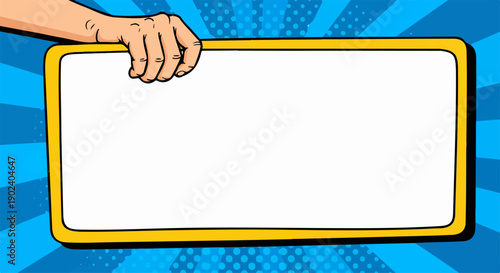 Pop art hand holding blank yellow sign on blue comic background with copy space.