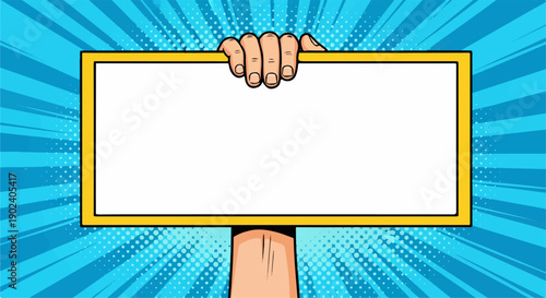 Pop art hand holding blank yellow sign on vibrant blue comic background.