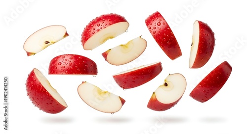 Floating red apple slices captured in motion, fresh healthy fruit isolated on white for commercial advertising