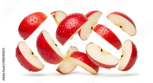 Floating red apple slices captured in motion, fresh healthy fruit isolated on white for commercial advertising