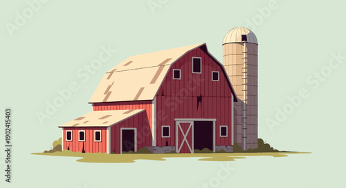 Red barn and silo under a pale sky