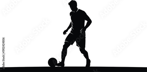 Professional soccer player in dynamic action kicking ball