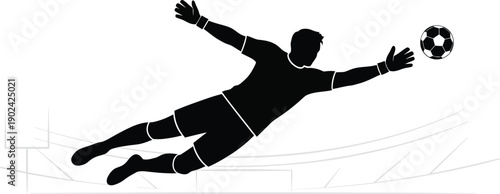 Goalkeeper diving to save soccer ball in action
