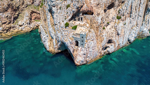 Photos The iconic facade of Porto Flavia ore loading terminal carved into the cliffs ab