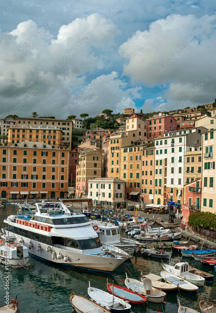 Fototapeta premium fishing town of Camogli, houses and boats in the port, Liguria, Italy