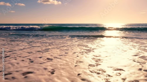 Wallpaper Mural Golden sunset waves gently caressing sandy beach at tranquil ocean horizon Torontodigital.ca