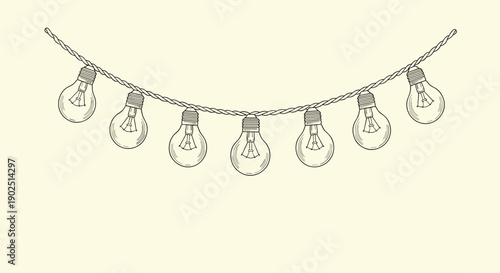 Decorative string of old fashioned light bulbs hanging on a rope for festive party and cozy interior lighting decor.