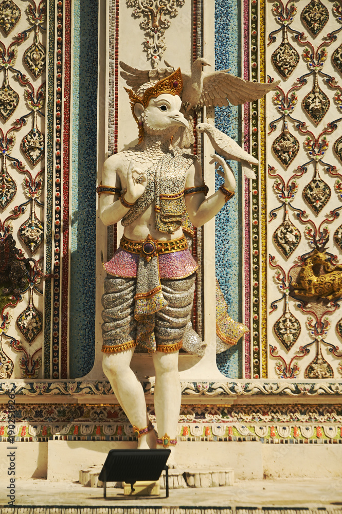 Fototapeta premium Contemporary stucco art decorative elements in the ordination hall of Wat Pariwat Ratchasongkhram incorporate concepts related to Buddhist beliefs, philosophy, and the past lives of the Buddha.Bangkok