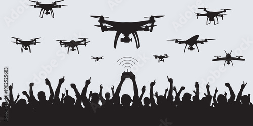 Crowd watching and cheering as multiple drones fly overhead, controlled by a person with a remote.